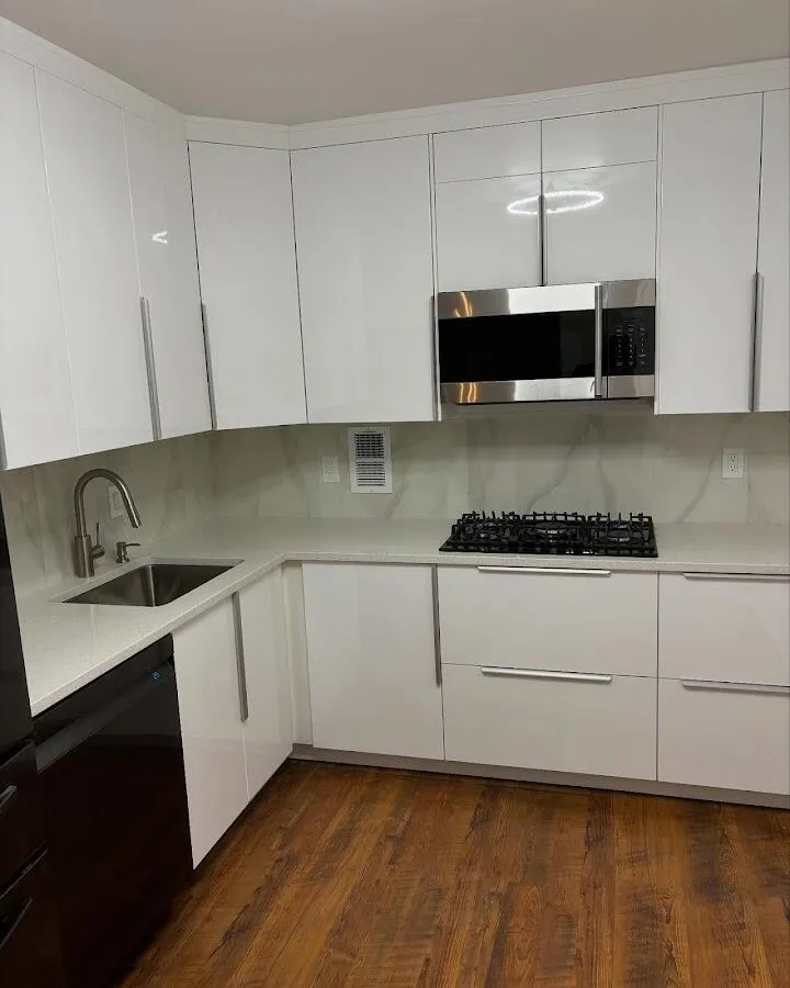 Restored kitchen with white cabinets after water damage in White House